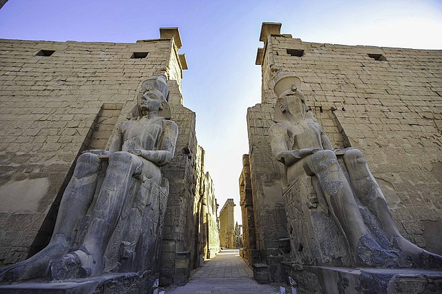 Statues of Ramesses II at the entrance through the first Pylon of Luxor Temple