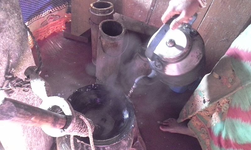 File:Addition of hot water during butter churning.jpg