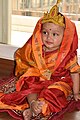 An infant girl dressed up like Godess Durga in Navratri