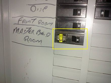 This AFCI (the circuit breaker with the yellow label) is an older generation AFCI circuit breaker. The current (as of 2013) devices are referred to as "combination type."