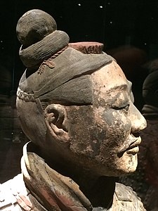 The head of an archer showing hair details and accessories