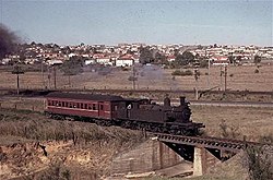 A C30 class steam locomotive leads the 'Camden Tram' towards the first grade after departing from Campbelltown Arhs campbelltown camden.jpg