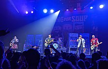 Nicholas (second from right) performing 1999 with Bowling for Soup on its release day