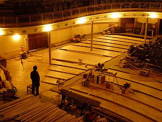 May 17, 2013: Re-decking the floor of the Music Hall continues with completion of the West Bank. Ponderosa Pine flooring is being replaced with more durable hickory, matching the original curved pattern but adding 6"/row. Braddock Carnegie Library Music Hall May 17, 2013.jpg