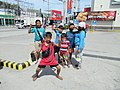 Bulakeño sampaguita garland vendors in the Philippines giving V sign 04