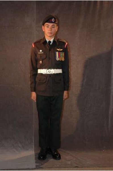 An Army Cadet wearing the C1 order of dress (Ceremonial Dress) before significant changes were made to the placement of medals.