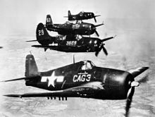 An F6F-5 flown by Air Group Commander (CAG), Cdr. Louis H. Bauer of Carrier Air Group 3 (CVG-3), leads a formation of CVG-3 aircraft (a Helldiver, Avenger and Bearcat) in 1946. Carrier Air Group 3 aircraft in flight 1946.jpeg