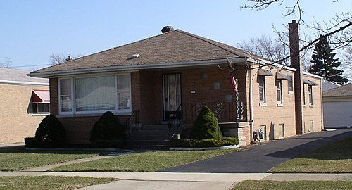 A raised bungalow in Chicago with a hipped roof