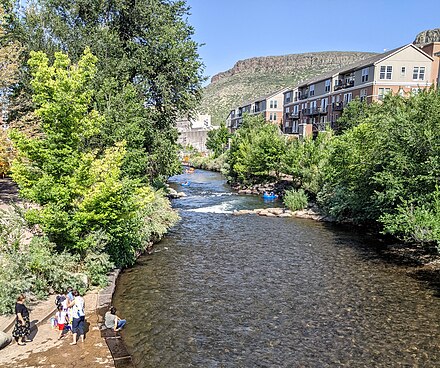 Clear Creek, looking east from the Washington Avenue bridge in Golden, with South Table Mountain and tubers