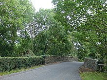 A railway telegraph pole beside a railway bridge on the former railway line between Portadown and Dungannon in Northern Ireland. Country Crossing - geograph.org.uk - 568823.jpg