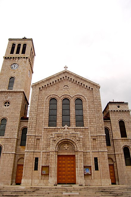 Neo-Romanesque St. Joseph church with characteristic bell tower.