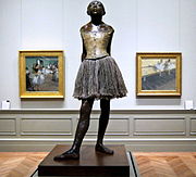 Little Dancer of Fourteen Years, cast in 1922 from a mixed-media sculpture modeled ca. 1879–80, Bronze, partly tinted, with cotton skirt and satin hair ribbon, on a wooden base, Metropolitan Museum of Art, New York City