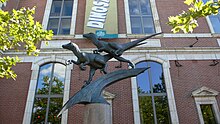 A bronze Deinonychus statue located outside the museum Deinonychus statue.jpg