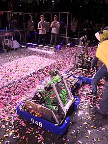 A robot surrounded by confetti
