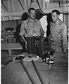 Dr Frederick Hase Rodenbaugh, Sr and Dr Lauren R Donaldson unpacking supplies, probably on board the USS CHILTON, summer 1947 (DONALDSON 24).jpeg