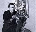 Eugene Suter in 1920 with the machine which would make him famous.jpg