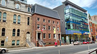 Opened in 1833, the First Toronto Post Office (centre) is a museum and a full-service Canada Post office. It is located next to George Brown College. First Toronto Post Office street view.jpg