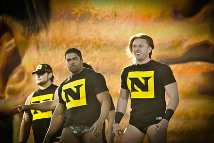 Harris (left) with David Otunga (center) and Heath Slater (right) as part of The Nexus in December 2010