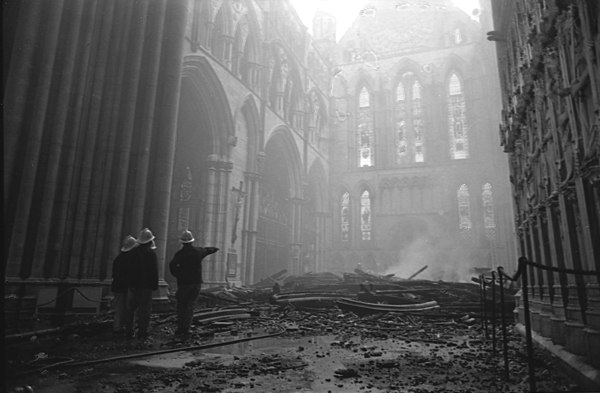 Firemen inspect damage the day after the fire in 1984