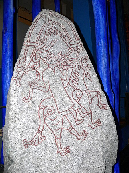 10th-century picture stone from the Hunnestad Monument that is believed to depict a gýgr riding on a wolf with vipers as reins, which has been propose