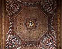A carved and painted wooden ceiling in the Bahia Palace (late 19th to early 20th century) Large riad pavillion decorative ceiling Bahia 1353.jpg