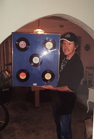 Leigh standing with his records Leigh and Records.jpg