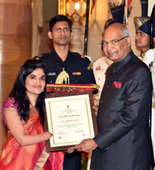 Dr. Malvika Iyer receiving the Nari Shakti Puraskar, the Highest Civilian Honor for Women for outstanding contribution to women's empowerment from the Honorable President of India Ram Nath Kovind on 8 March 2018 on the occasion of International Women's Day. Malvika Iyer.png