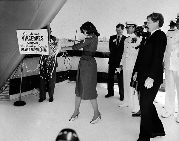 Marilyn Quayle christens the USS Vincennes (CG-49) by breaking a bottle of champagne on its bow during a ceremony at Ingalls Shipbuilding