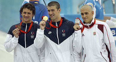 From left to right: Ryan Lochte (bronze), Michael Phelps (gold), both from USA, and László Cseh from Hungary (silver) show off the medals they earned from the men's 400 metre individual medley.