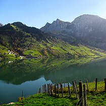 Mountain lake showing surface water. Geoenvironmental engineers (subdiscipline of geological engineering) work on managing drinking water supplies and remediation of contaminated surface water and groundwater. Mountain lake geoenvironmental engineering.jpg