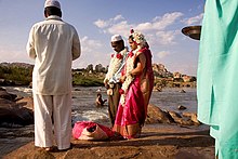 A Muslim couple being wed alongside the Tungabhadra River at Hampi, India Muslim wedding in India.jpg