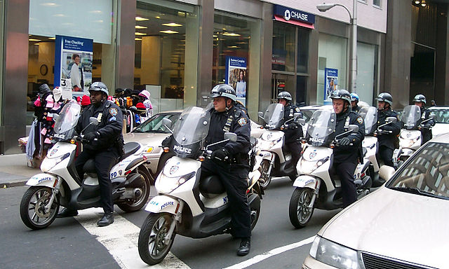 NYPD officers on scooters