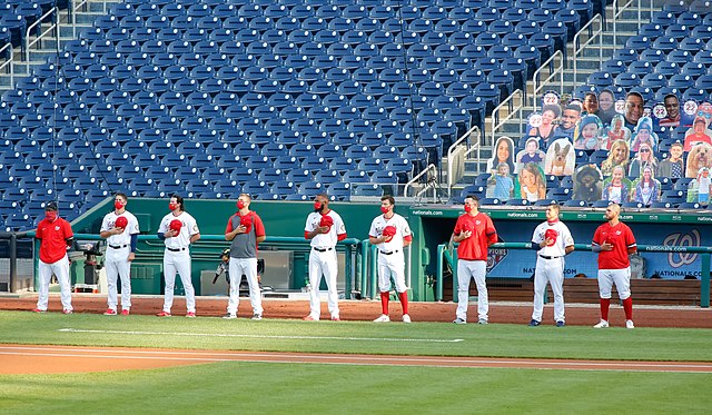 Washington Nationals players during the national anthem in front of cardboard fans, 2020