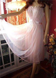 Negligee Sheer or heavily trimmed womans nightgown or dressing gown