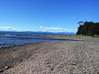 The beach at Orere Point, and outlet for the Orere River Orere Point beach2.jpg