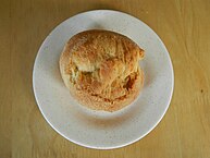 The "putok" is a variation on the pandesal made from monay dough