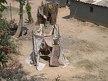 A pit latrine with failing superstructure in Zambia. Pit latrines in Zambia (3233256285).jpg