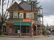 Photograph of a multi-level building from across the street