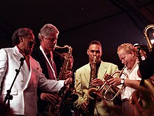 Bill Clinton playing the saxophone President Bill Clinton plays the saxophone with jazz musicians.jpg