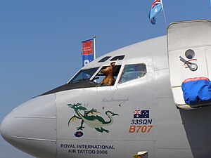Boeing 707 nose and cockpit with toy kangaroo at open window and cartoon of a dragon on the fuselage, along with the words "33SQN B707", "Castlereagh" and "Royal International Air Tattoo 2006"