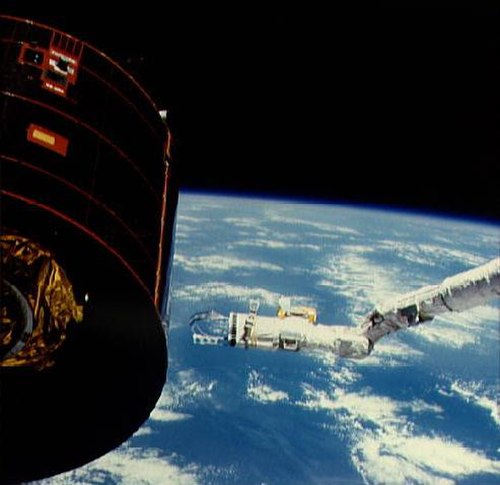 The crew attempt to activate Syncom IV-3 via a "flyswatter" device attached to Discovery's Canadarm