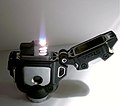 A storm-proof piezo-ignited lighter/rope burner