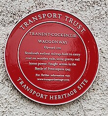 A plaque marking the Tranent to Cockenzie Waggonway, across which the Battle of Prestonpans was fought. Tranent-Cockenzie Waggonway Red Wheel plaque.jpg