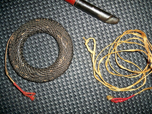 Making a primitive sinew bow string with reverse twist cordage method 