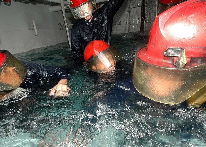 File:US Navy 051006-N-3019M-011 Sailors assigned to the guided missile frigate USS Reuben James (FFG 57), plug a leaking bulkhead during the Damage Control Olympics.jpg