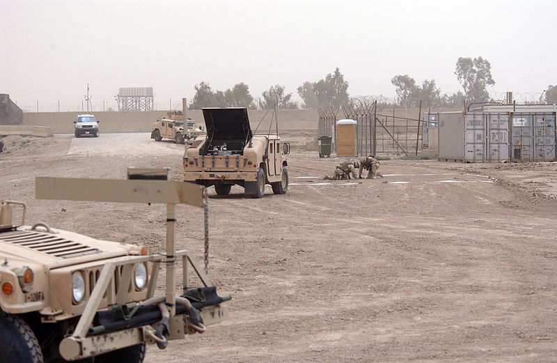 File:US Navy 060524-F-1424R-011 U.S. Navy Sailors assigned to Disposal Mobile Unit dig up a rocket that landed in Camp Victory, Iraq.jpg