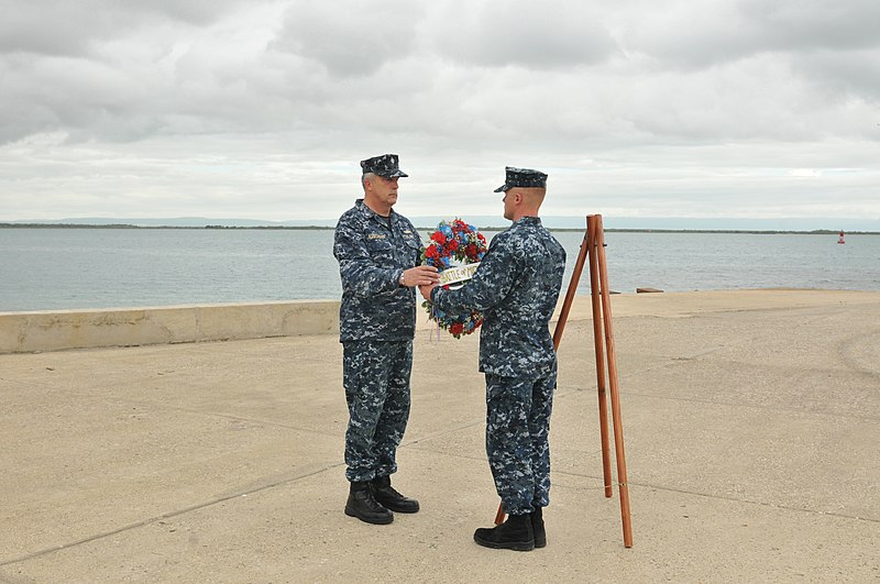 File:US Navy 110603-N-AL752-089 Construction Electrician 2nd Class Jeremy Keller presents a wreath to Cmdr. William Rabchenia during a wreath-laying cer.jpg