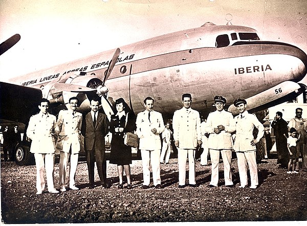 Crew of the inaugural Iberia service to Buenos Aires in 1946 with the Douglas DC-4 used for the flight.