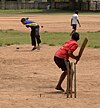 Children playing cricket in Kochi, Kerala