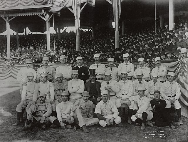 Charles "Old Hoss" Radbourn (standing, far left) giving the finger to the cameraman, the first known photograph of the gesture (1886)